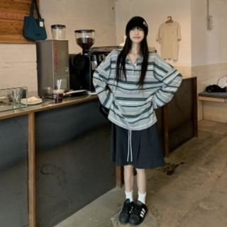 Striped Long-Sleeve Polo Paired with Cinched A-Line Skirt