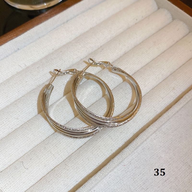 Tone Designs) Earring Silver (Various