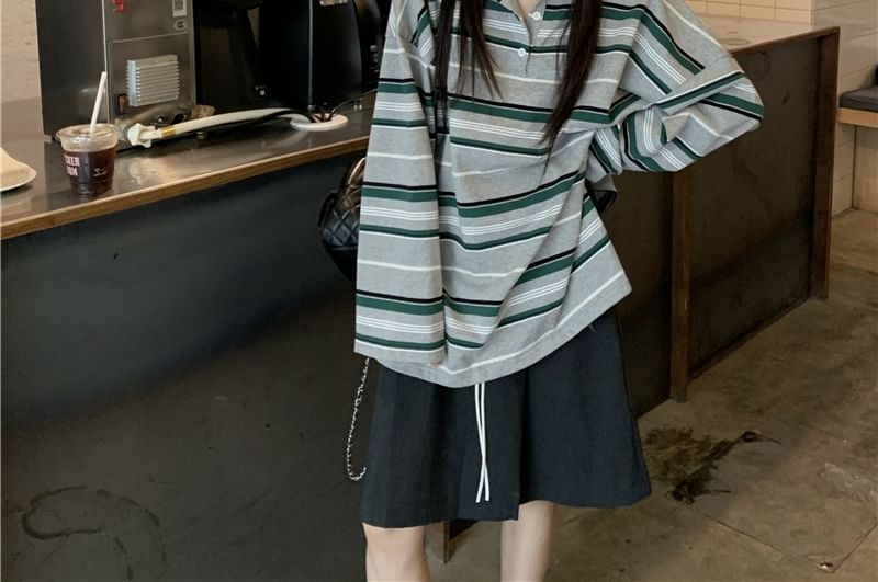 Striped Long-Sleeve Polo Paired with Cinched A-Line Skirt