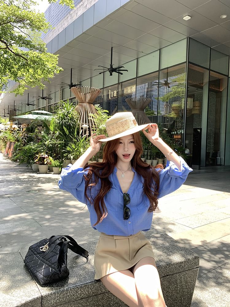 Long-Sleeve V-Neck Solid Blouse Paired with High-Waist Flared Mini Skirt