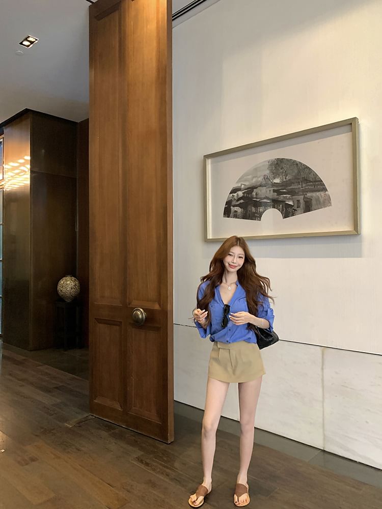 Long-Sleeve V-Neck Solid Blouse Paired with High-Waist Flared Mini Skirt
