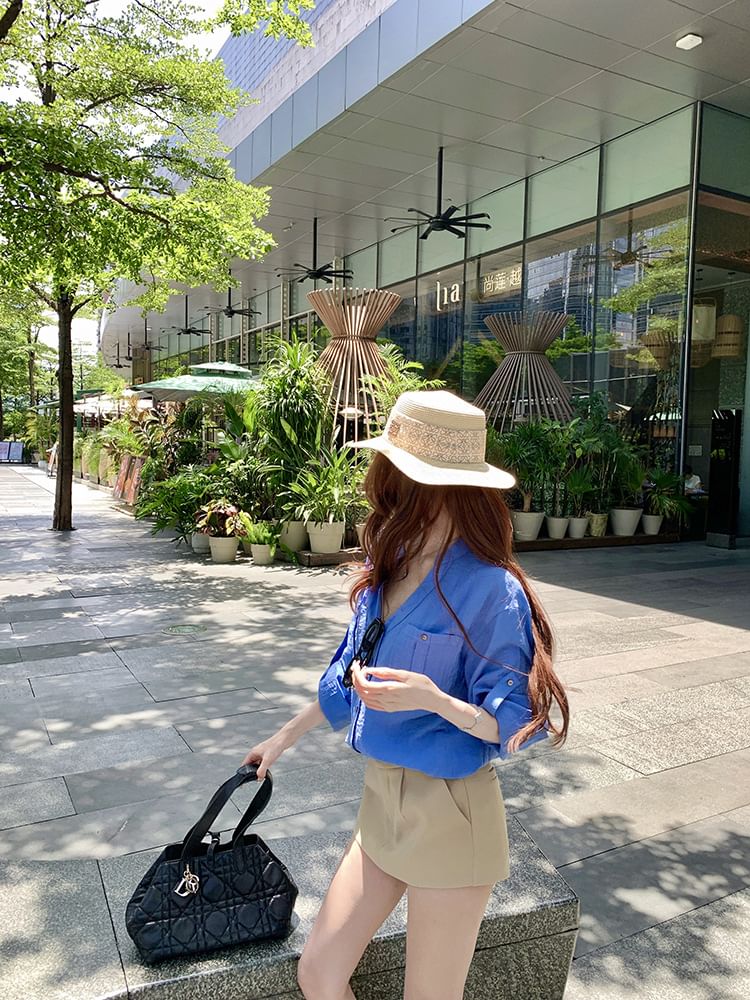Long-Sleeve V-Neck Solid Blouse Paired with High-Waist Flared Mini Skirt