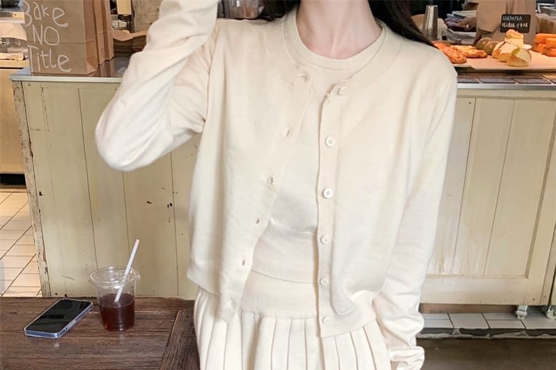 Crew Neck Knit Tank, Pleated Mini Skirt, and Cardigan Set